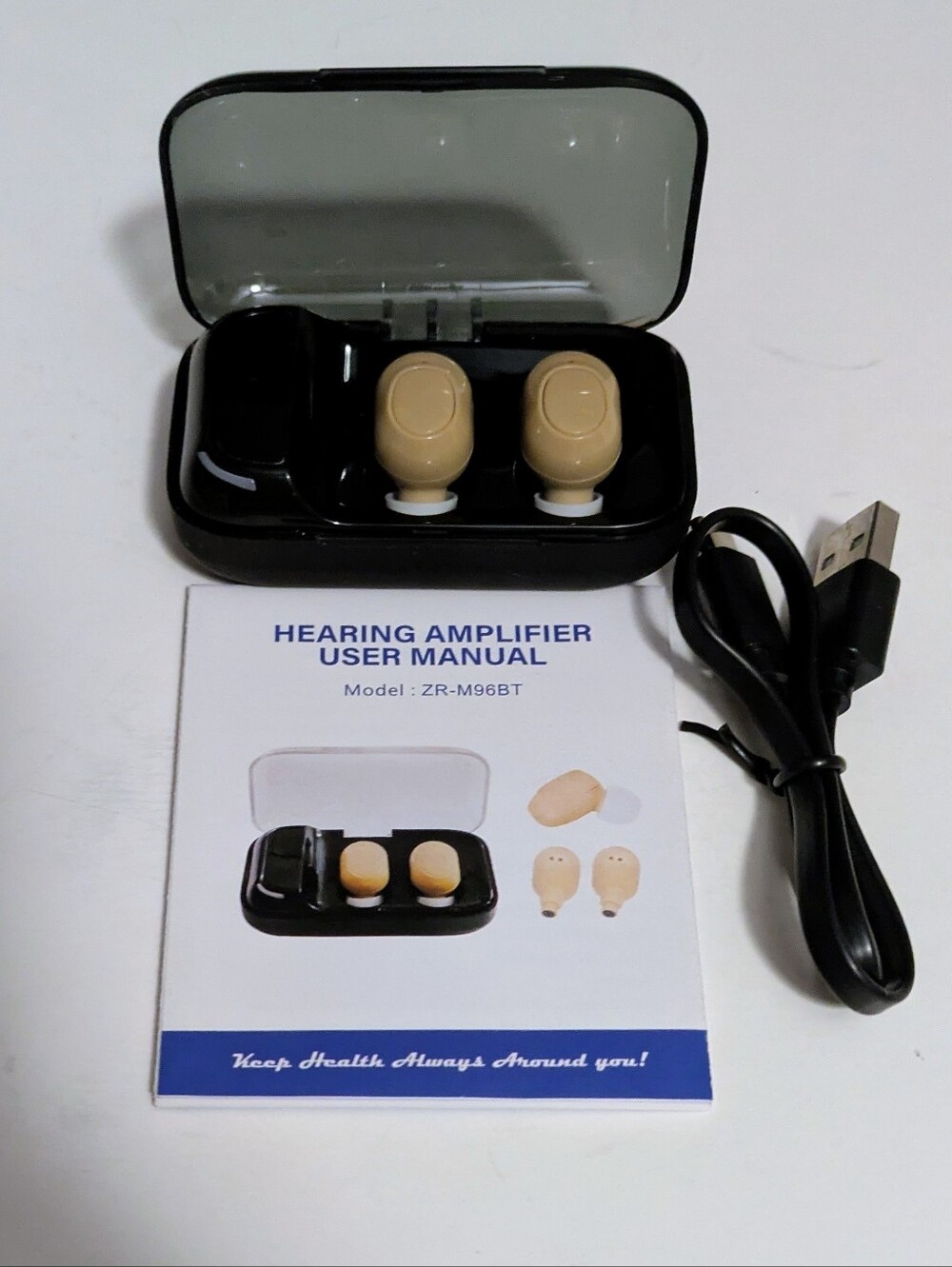 Hearing Wireless Amplifier Earbuds in Beige with Black Charging Case Accessories